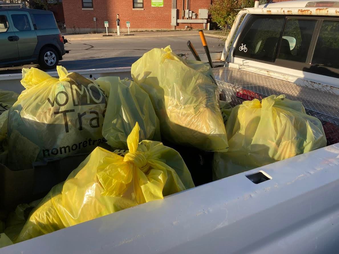 Image of trash bags in the back of a truck.